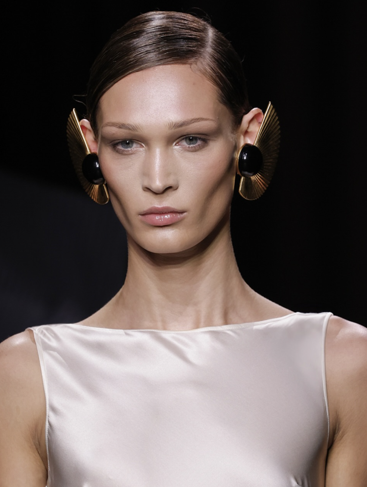 Nina Ricci SS25 runway — oversized half-circle earrings designed by Elsa Sen